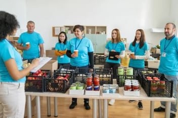 Nonprofit workers in a food delivery line