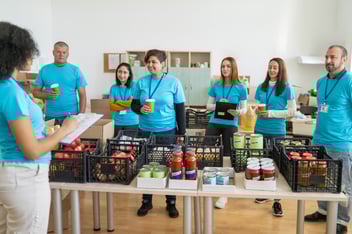 Nonprofit workers in a food delivery line