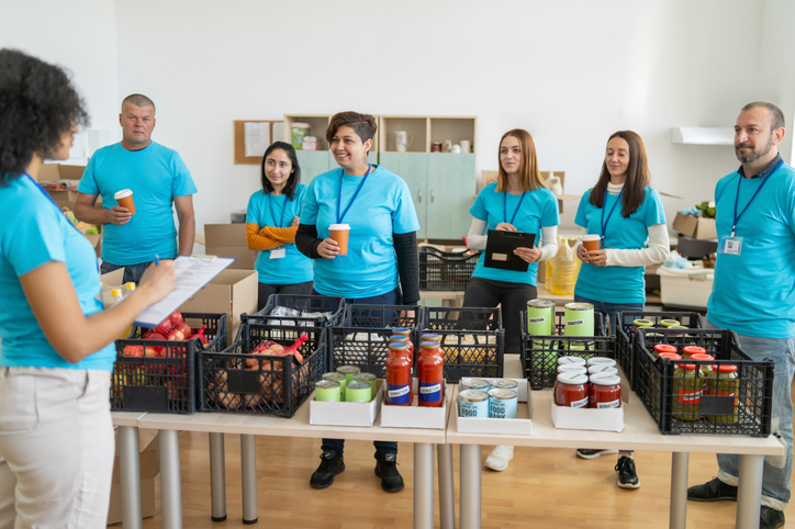 Nonprofit workers in a food delivery line