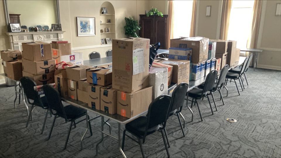 Amazon shipment boxes neatly stacked on tables