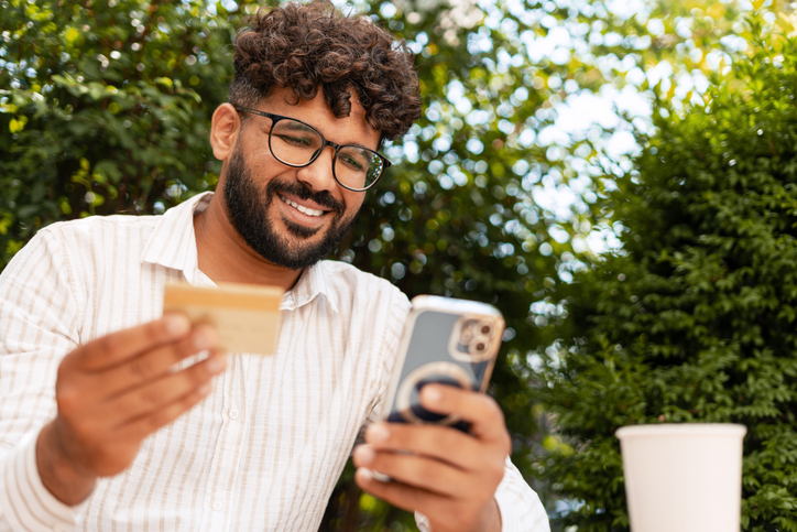 Man making an in-kind donation on his mobile phone